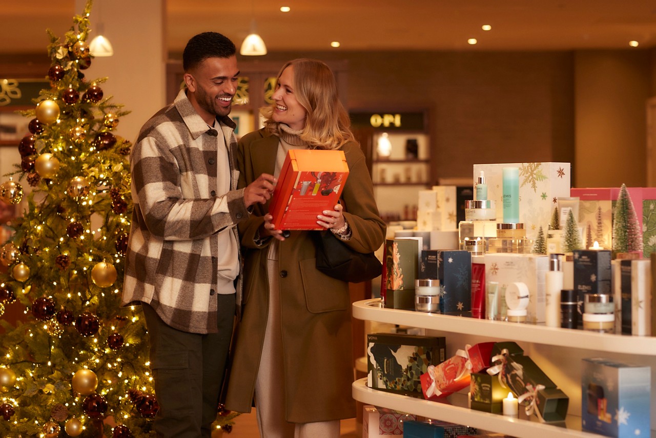 Couple shopping for presents in the Forest Spa Boutique.